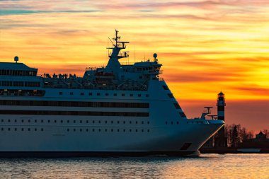 White cruise liner at sunset