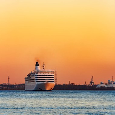 White cruise liner at sunset