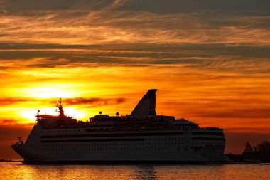 White cruise liner at sunset
