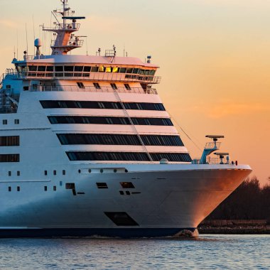 White cruise liner at sunset