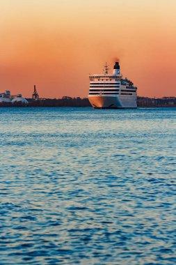 White cruise liner at sunset