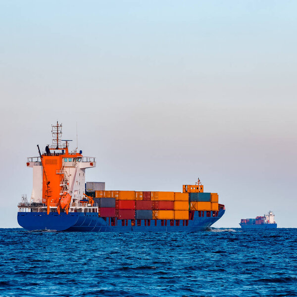 Blue container ship underway