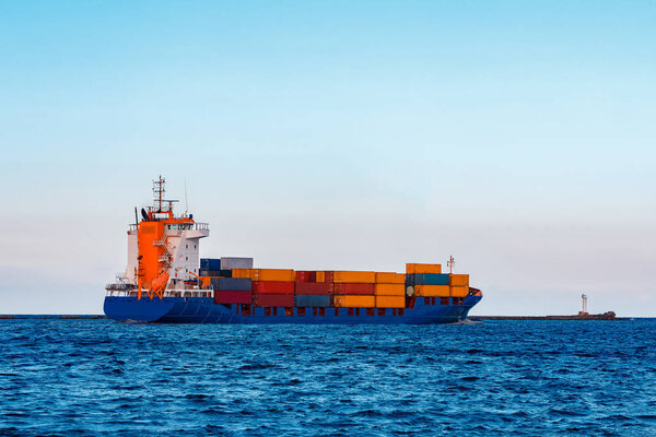 Blue container ship. Global logistics and merchandise transfer