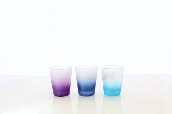 Shotglasses in a Row with White Background — Stock Photo, Image