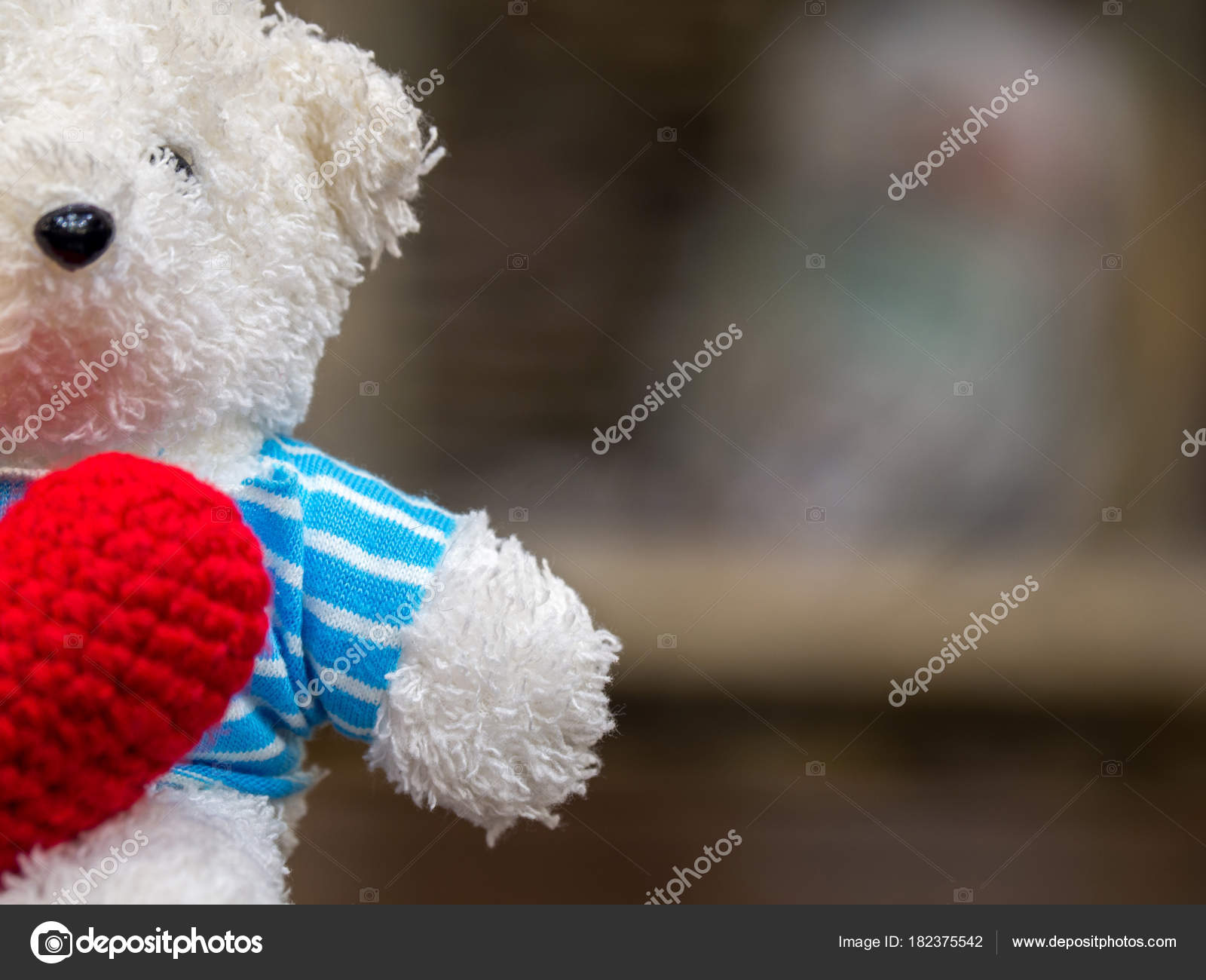 white teddy bear with red heart