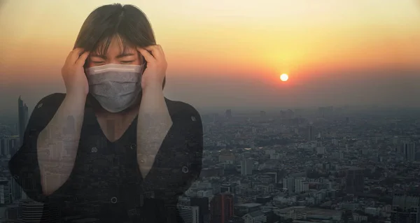 Asian women wear mask to prevent disease coronavirus 2019-nCoV. The concept of fear and anxiety about communicable diseases coronavirus 2019-nCoV, SARS, Bird flu and Influenza H5N1 and PM2.5