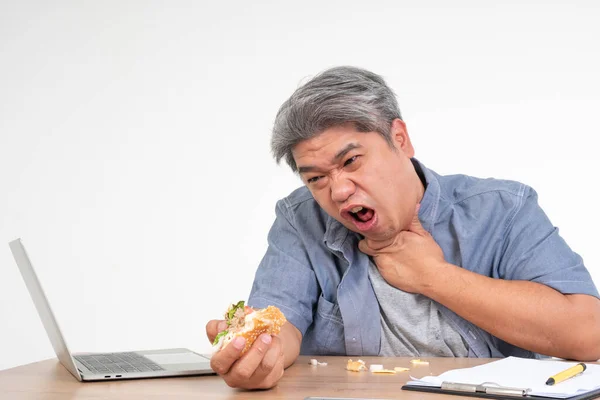 Asian Man Working Eating Burger Office Desk Holding His Neck — Stock Photo, Image