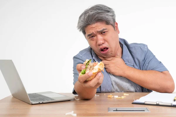 Asian Man Working Eating Burger Office Desk Holding His Neck — Stock Photo, Image