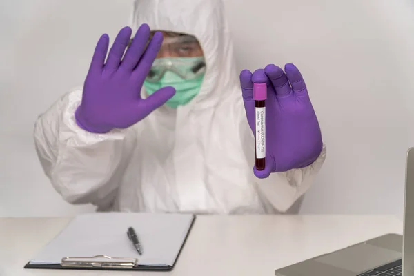 Doctors Protective Suits Masks Holding Positive Blood Test Result New — Stock Photo, Image