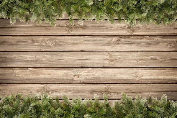 Kerst houten achtergrond met dennenboom — Stockfoto