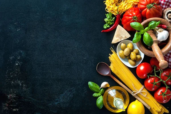 Italian food ingredients on slate background
