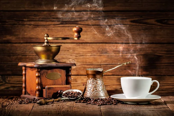 Coffee grinder, turk and cup of coffee — Stock Photo, Image