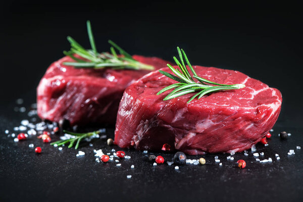 Raw beef fillet steaks with spices