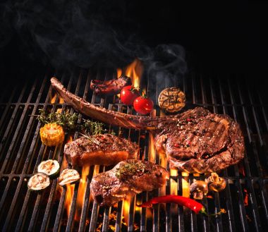 Beef steaks on the grill clipart