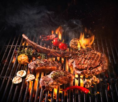 Beef steaks on the grill clipart