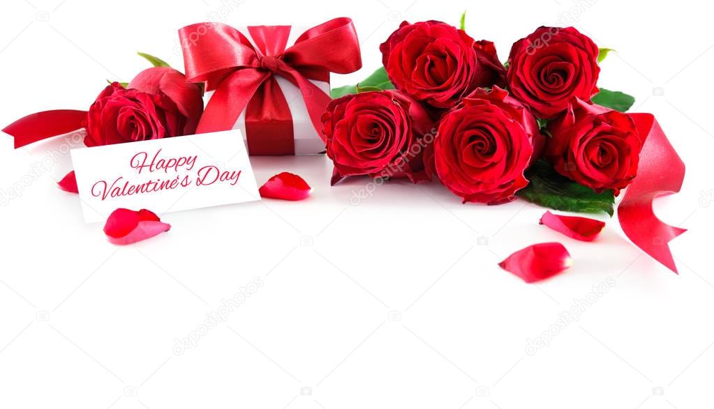 Bouquet of red roses and gift box isolated on white background