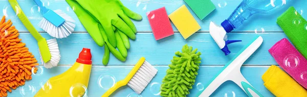 Colorfull cleaning items on blue wooden — Stock Photo, Image