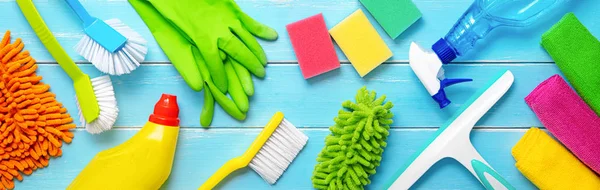 Colorfull cleaning items on blue wooden — Stock Photo, Image