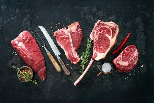 Variety of raw beef meat steaks for grilling