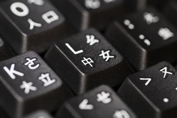 Black keyboard with multi languages. Selective focus.
