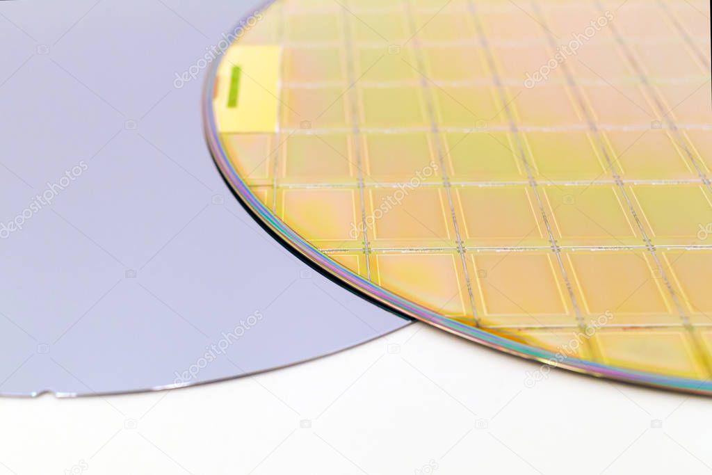 Silicon Wafers two types -empty grey wafer and gold wafes with microchips