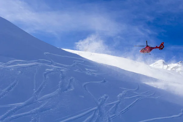 Austria Zillertal - February 5 2019 : Mountain Rescue Helicopter.Red helicopter flying in Alps mountain in winter, Austria — 스톡 사진