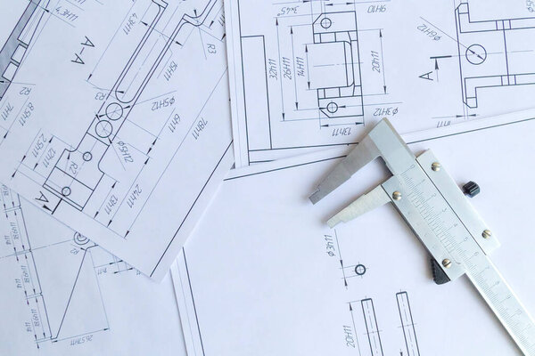 Top view of a caliper measuring tool, ruler and detail drawings