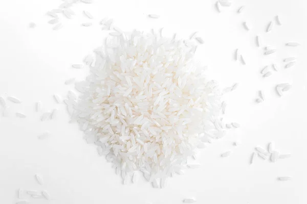 Grãos de arroz sobre um fundo branco Imagens Royalty-Free