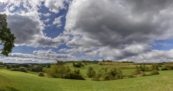 Thick clouds on green fall  countryside, Germany — Stock Photo, Image
