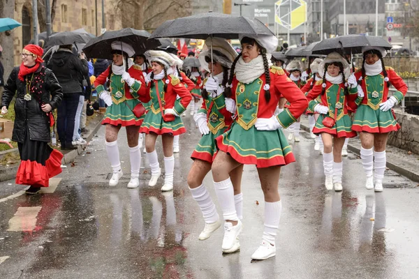 Majorettes march under black umbrella at Carnival parade, Stuttg — Stock Photo, Image