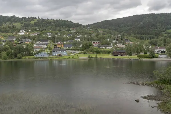 Village on green lake shore, near Al, Norway — Stock Photo, Image