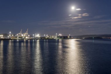 WELLINGTON, NEW ZEALAND - November 12 2019: cityscape with moon light on northern side of Lambton bay with industrial harbor quays, shot in moon night light on november 12 2019 at Wellington, North Island, New Zealand