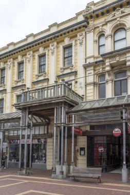 WELLINGTON, NEW ZEALAND - November 13 2019: cityscape with old glass canopy, covered walkway and historical buildings on street at downtown, shot in bright cloudy spring light on november 13 2019 at Wellington, North Island, New Zealand