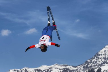 CHIESA VALMALENCO, ITALY - MARCH 31, 2017: Freestyle Ski FIS European Cup, athlete jump clipart