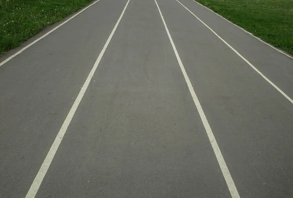 road in a sports stadium, vertical lines