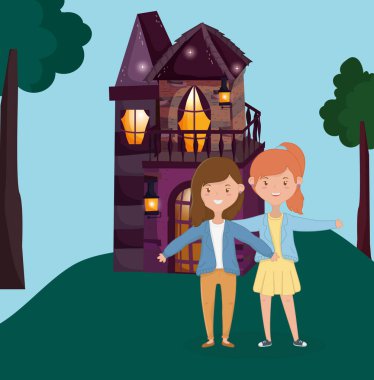 women standing hugging in front of the cottage