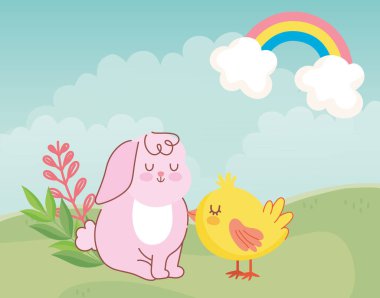 Mutlu Paskalya tatlı tavşan ve çayırda oturan tavuk