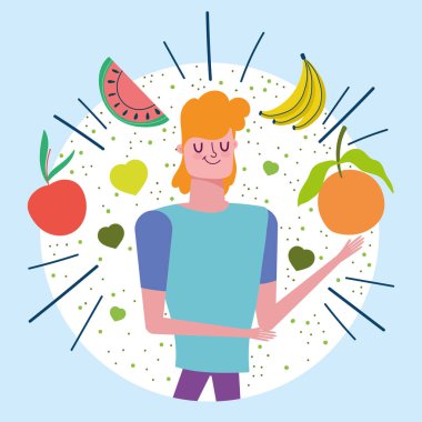 Tropikal meyveleri olan genç bir adam sağlıklı bir yaşam sürüyor.