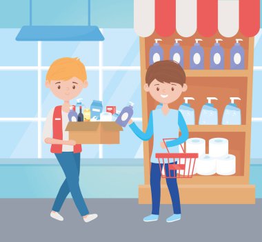 Süpermarkette kutu ve sepeti olan genç adamlar fazla alışveriş yapıyor.