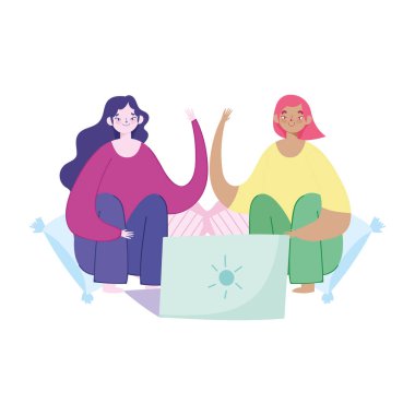 Uzaktan çalışan, dizüstü bilgisayarlı genç kadınlar.