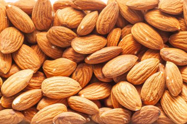 Badem fıstığı arka plan yakın plan. Sağlıklı ve sağlıklı yiyecekler. Ben de.