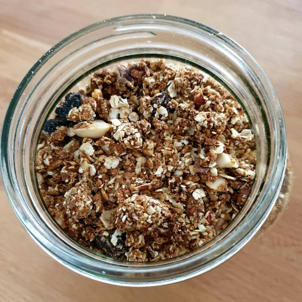 Closeup Homemade Granola Open Glass Jar Wooden Table Background — Stock Photo, Image