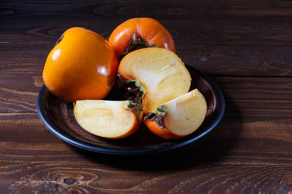 Persimmon Bowl Wooden Table Closeup — Stock Photo, Image