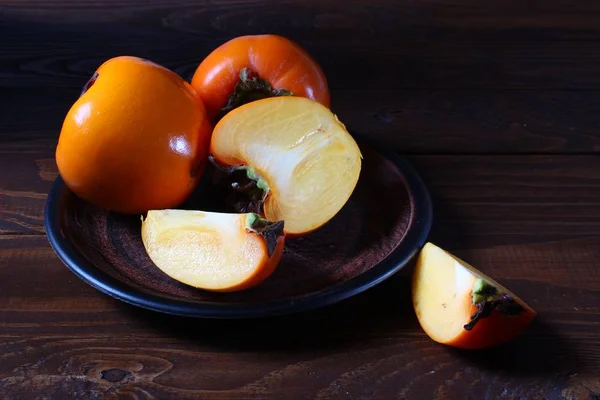 Persimmon Bowl Wooden Table Closeup — Stock Photo, Image