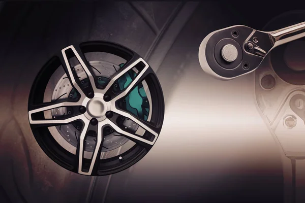 Double exposure. Repairing wheel concept. Wheel of racing car — Stock Photo, Image