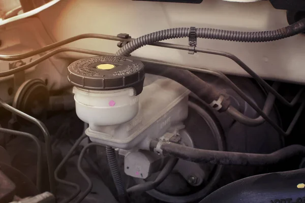 Brake fluid reservoir in engine room of a car. — Stock Photo, Image