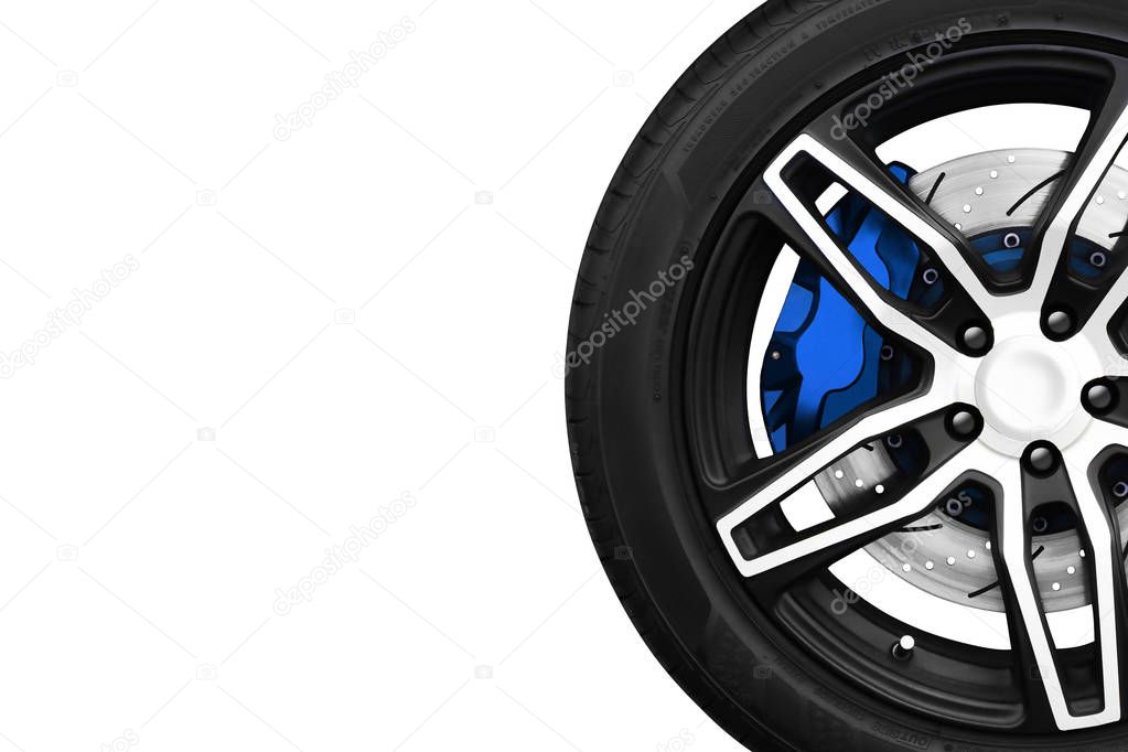 Alloy wheels of racing car with metal brake discs and blue caliper.