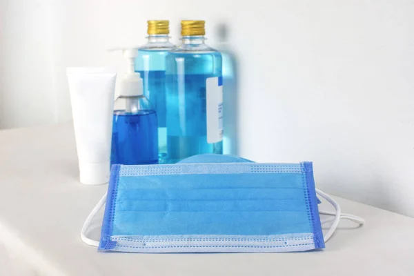 Medical mask and alcohol sanitizer for cleaner sterilize on white table with copy space,Coronavirus,Covid-19 prevent infection.