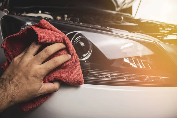 Hand Cleaning Car Headlight Using Red Microfiber Cloth Automotive Maintenance — Stock Photo, Image