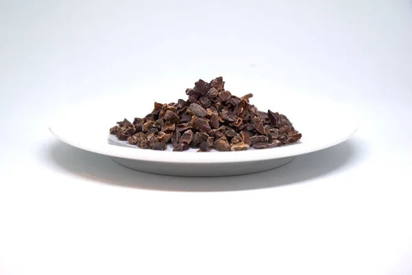 cacao nibs on a plate isolated